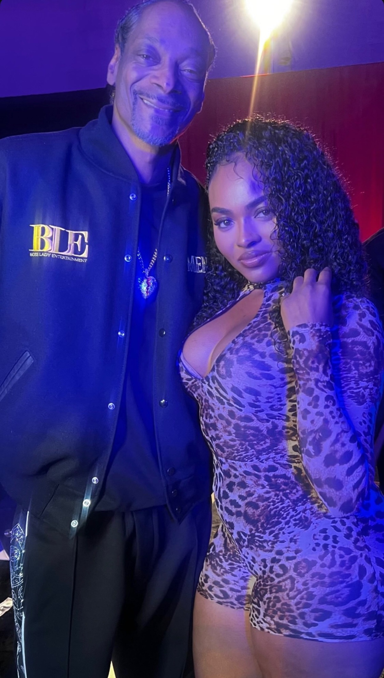 Snoop Dogg with BLV talent at an event